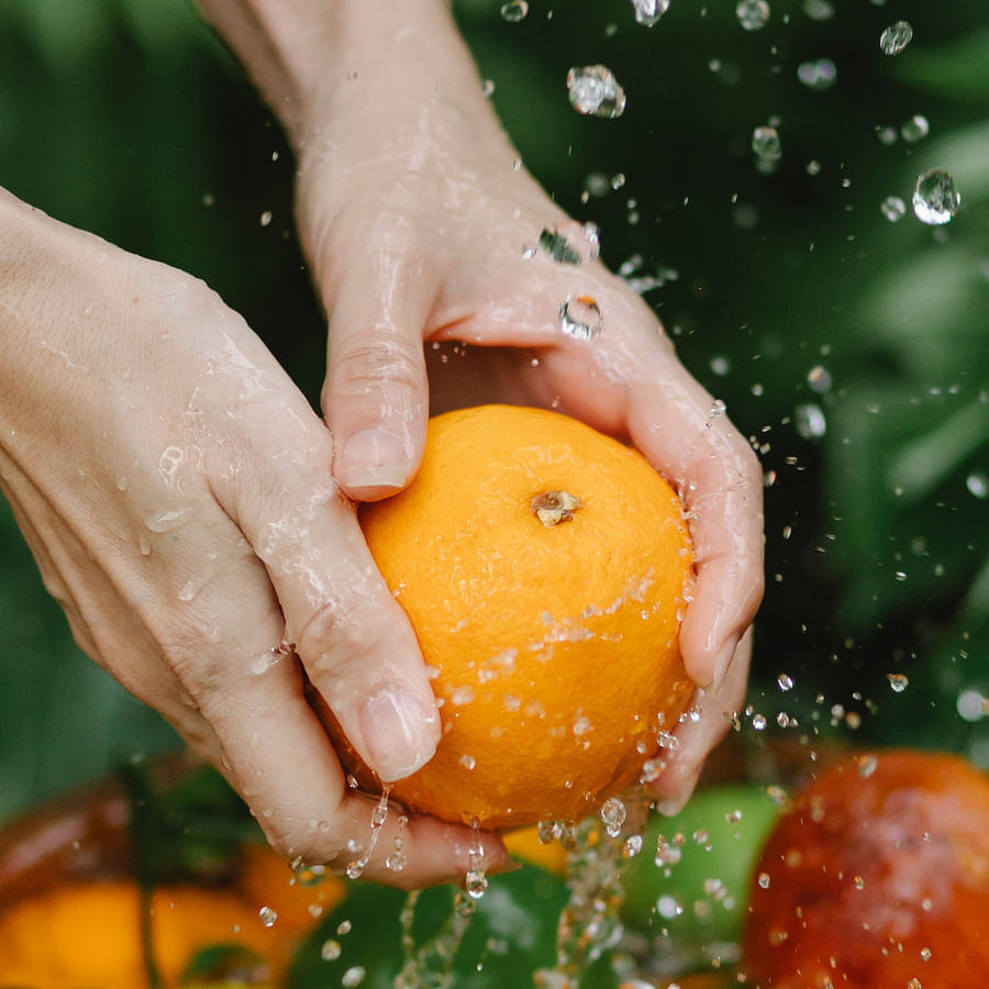 Canning jars being sterilized in boiling water for food safety