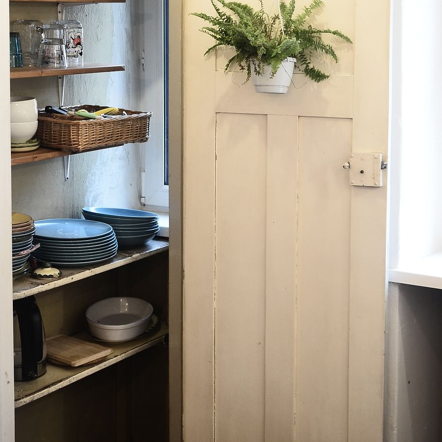 Sterilized canning jars neatly arranged and stored in a pantry